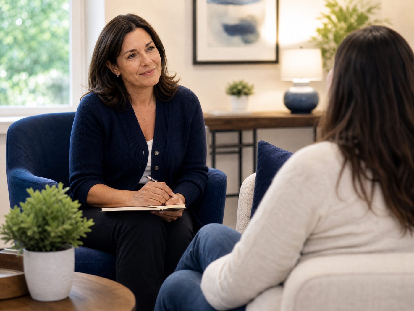 A licensed therapist at Atascocita Counseling Associates listening warmly and compassionately to a client during a counseling session.